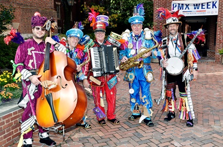 Members of the Fralinger String Band in colorful Mummers outfits, playing music in the Elm Garden